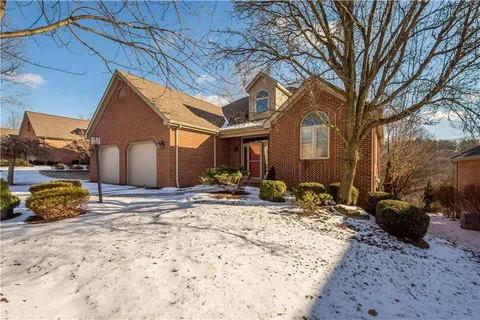 a view of a house with snow in the background