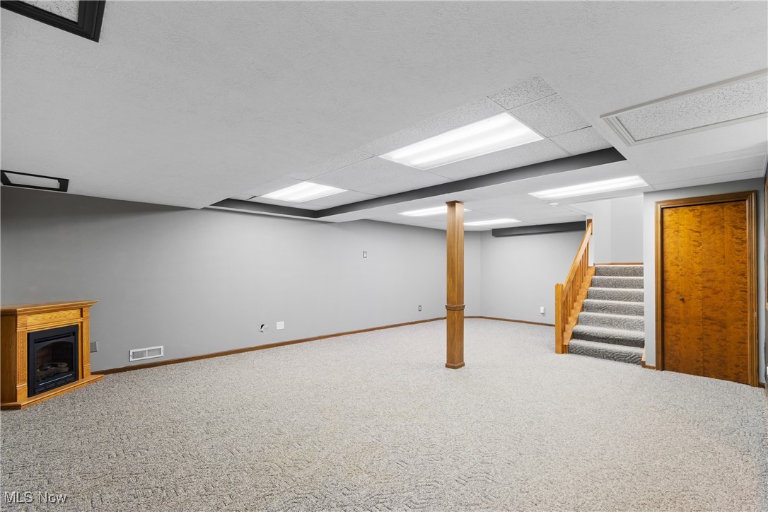 2317 Raintree Street Northeast Canton, OH 44705 - Photo 29 of 40 Finished below grade area with carpet floors and stairway