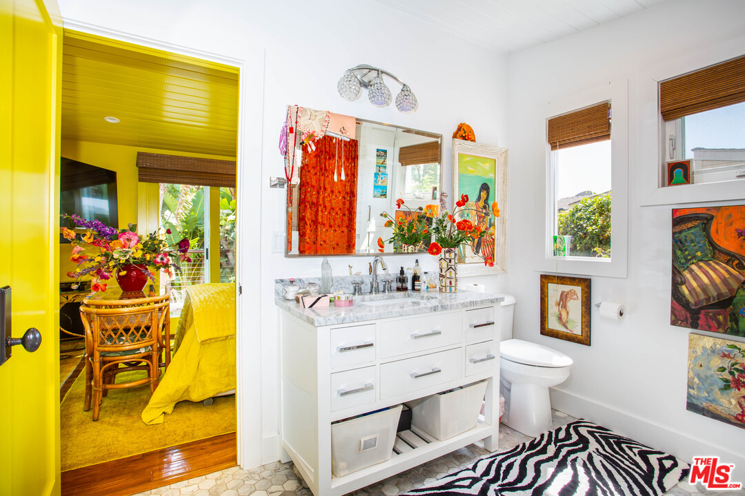 232 Paradise Cove Road Malibu, CA 90265 - Photo 13 of 38 a bathroom with a sink mirror vanity and toilet