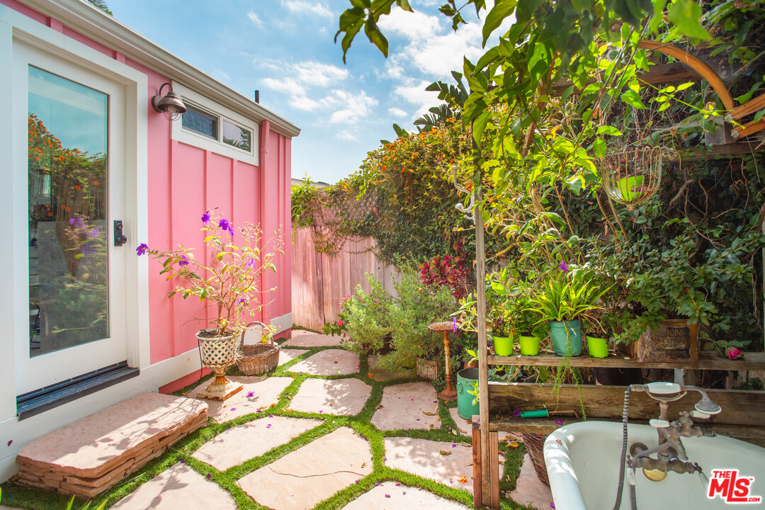 232 Paradise Cove Road Malibu, CA 90265 - Photo 32 of 38 a front view of a house with a yard