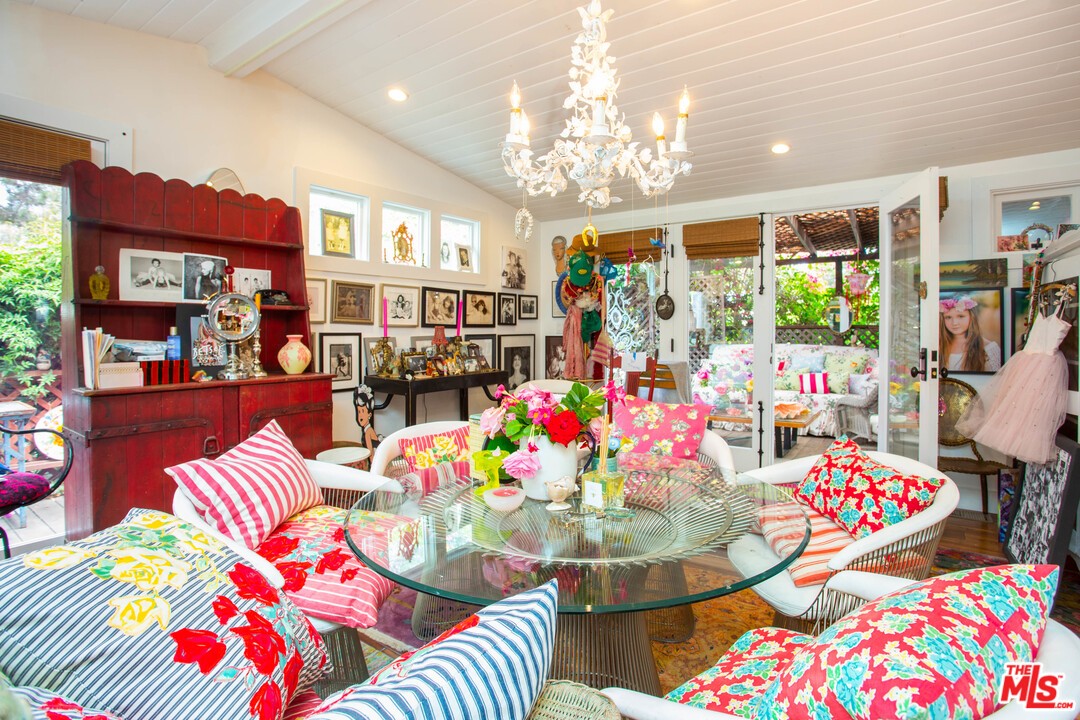 232 Paradise Cove Road Malibu, CA 90265 - Photo 4 of 38 a dining room filled with lots of furniture and chandelier