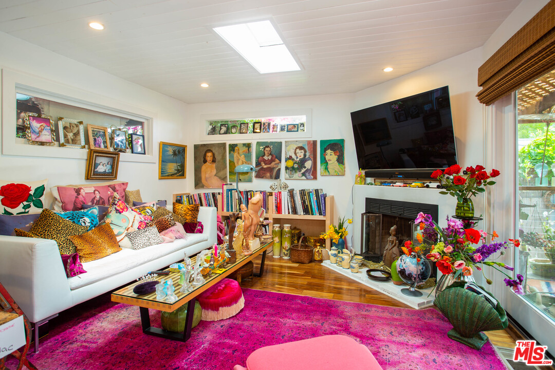 232 Paradise Cove Road Malibu, CA 90265 - Photo 8 of 38 a living room with lots of furniture and a flat screen tv