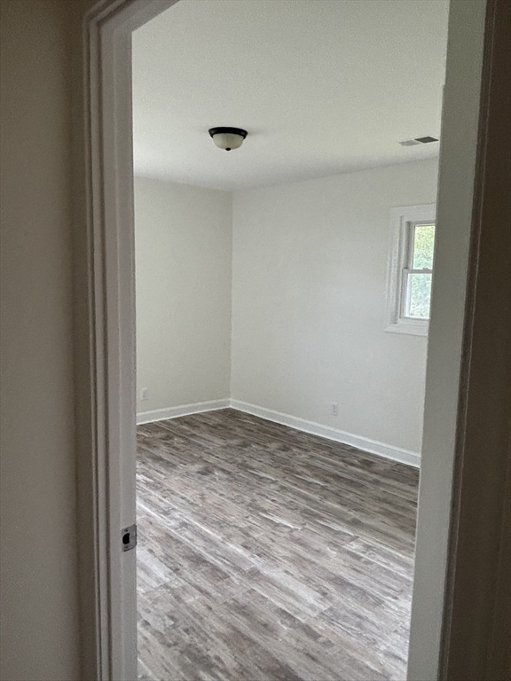 1165 Nantasket Avenue Hull, MA 02045 - Photo 34 of 39 a view of empty room with wooden floor