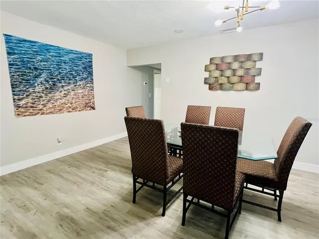 a bathroom with a double vanity sink toilet mirror and shower