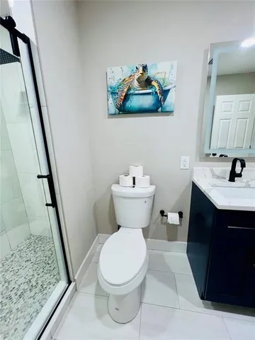 a view of a patio with table and chairs and potted plants