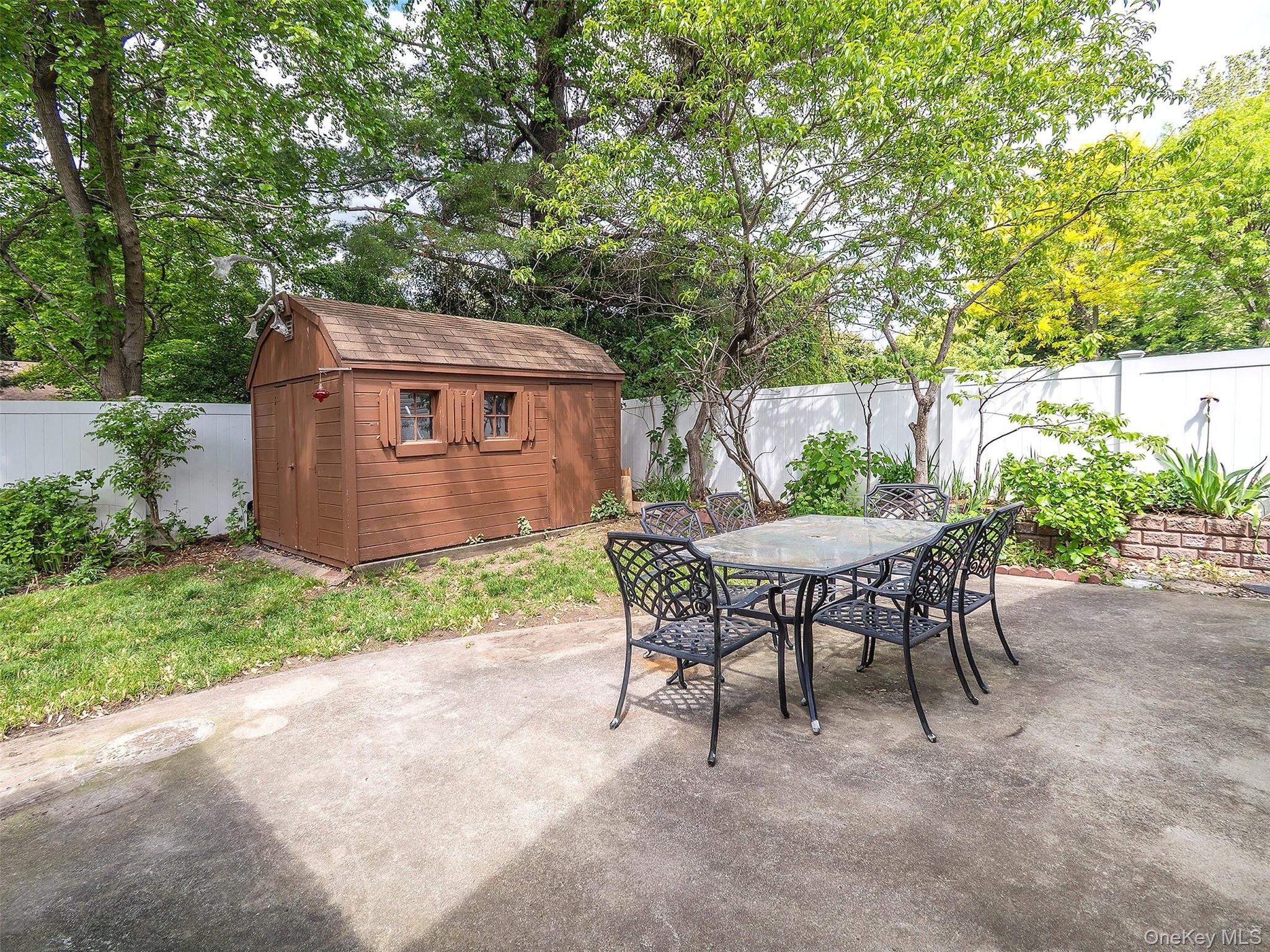 21 Marwood Road North Port Washington, NY 11050 - Photo 25 of 35 a view of backyard with seating and green space