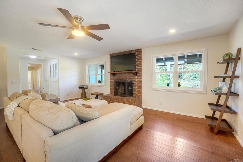 2830 Green Canyon Road Fallbrook, CA 92028 - Photo 14 of 43 A cozy fireplace & beautiful views overlooking the front porch & citrus orchard