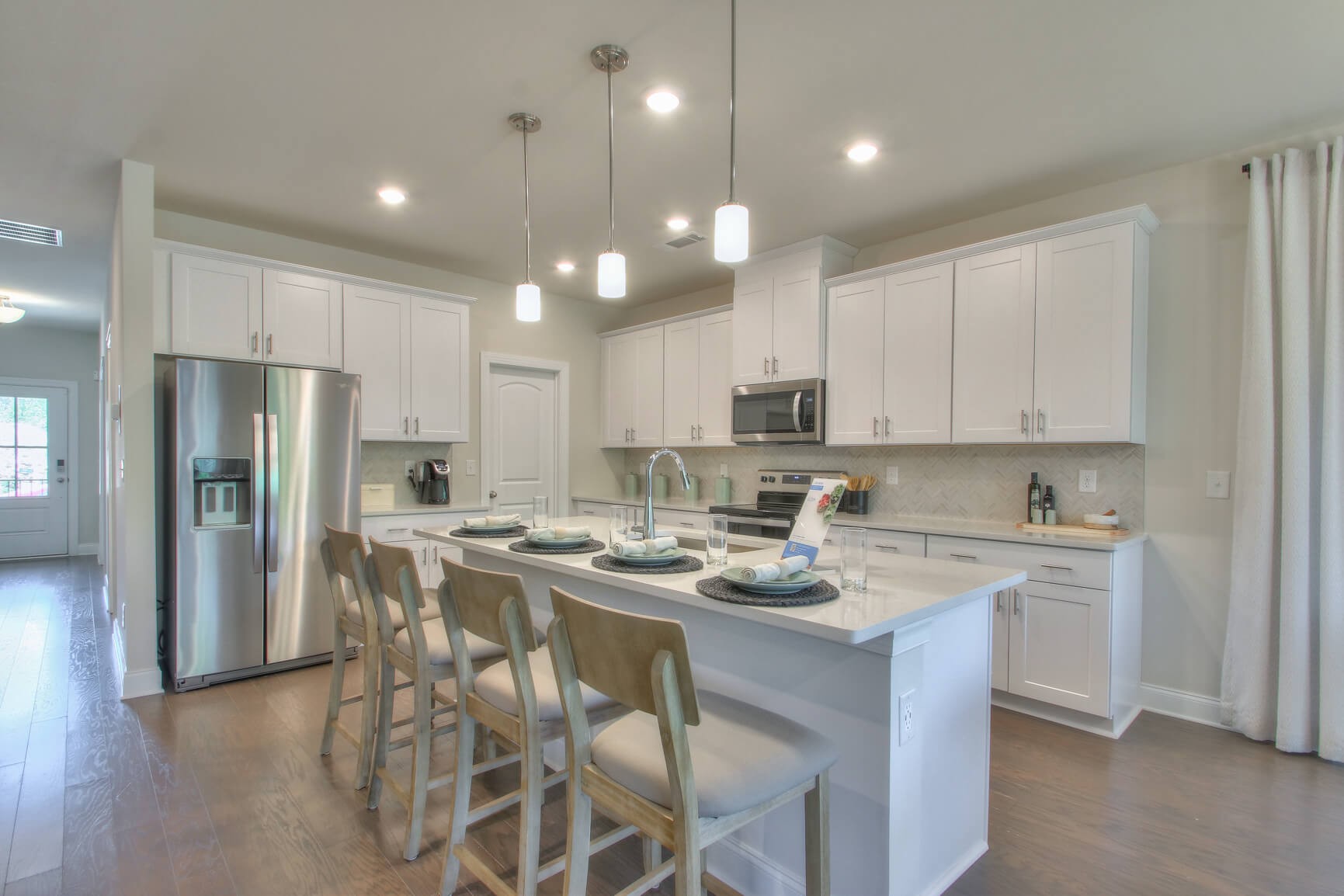 3528 Mathewson Way Murfreesboro, TN 37128 - Photo 2 of 22 a kitchen with stainless steel appliances granite countertop a center island wooden floor cabinets and a refrigerator