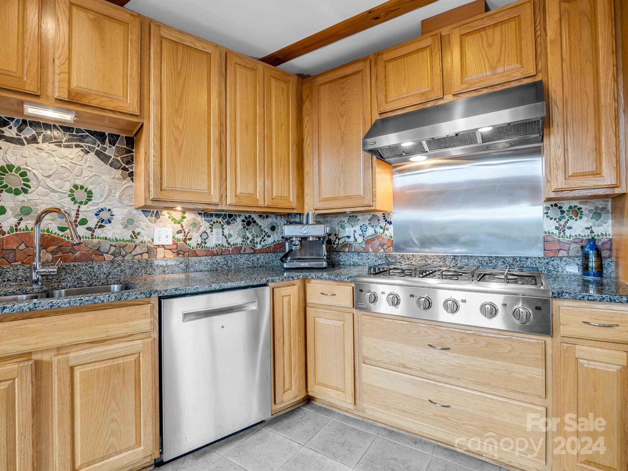 255 Oscar Young Road Mars Hill, NC 28754 - Photo 23 of 48 a kitchen with granite countertop cabinets stainless steel appliances and a sink