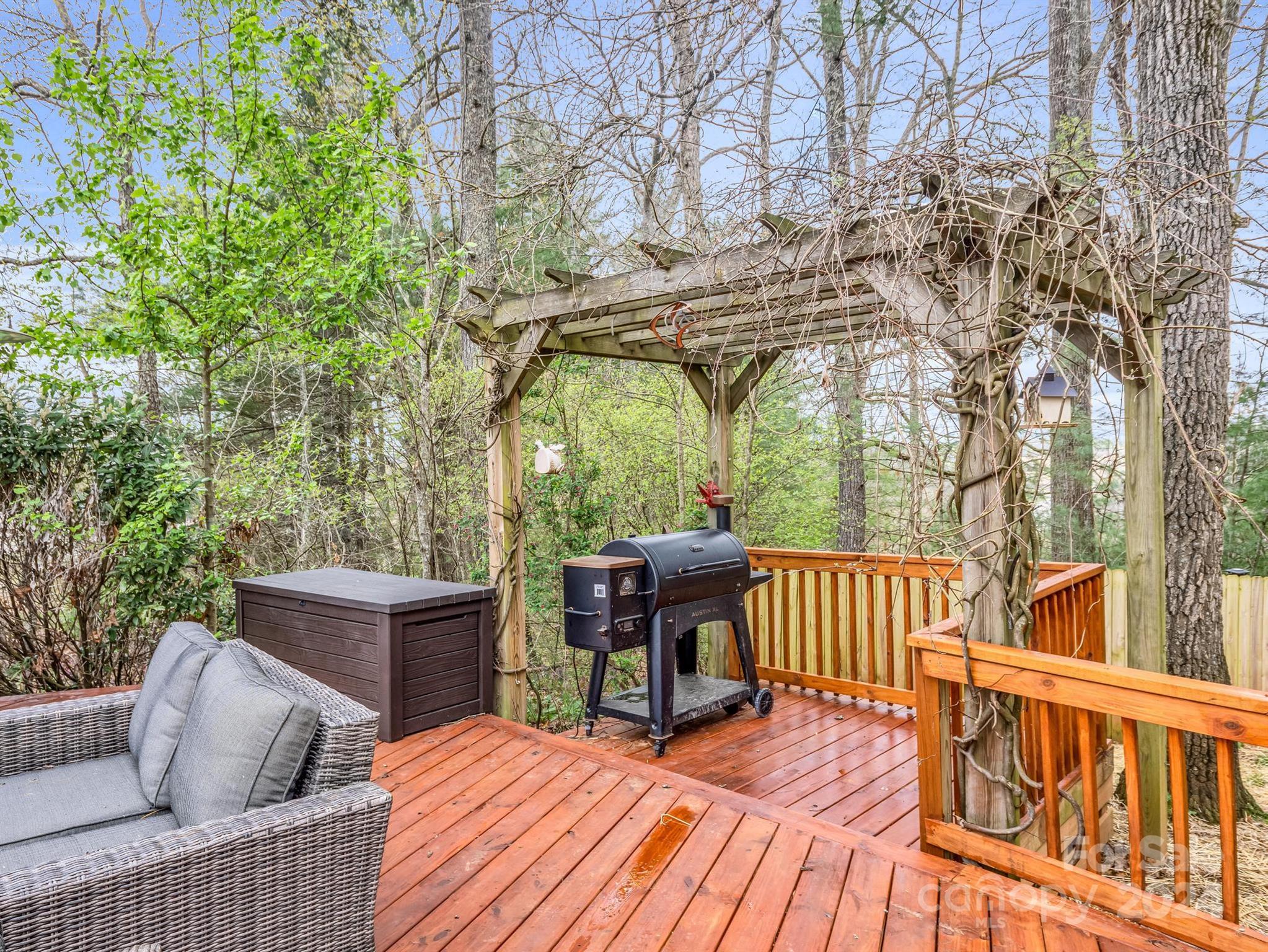 255 Oscar Young Road Mars Hill, NC 28754 - Photo 44 of 48 a view of backyard with deck and outdoor seating
