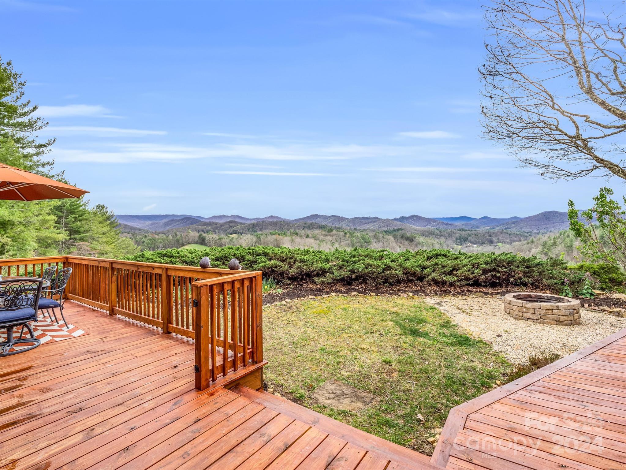 255 Oscar Young Road Mars Hill, NC 28754 - Photo 6 of 48 a view of a terrace with outdoor seating