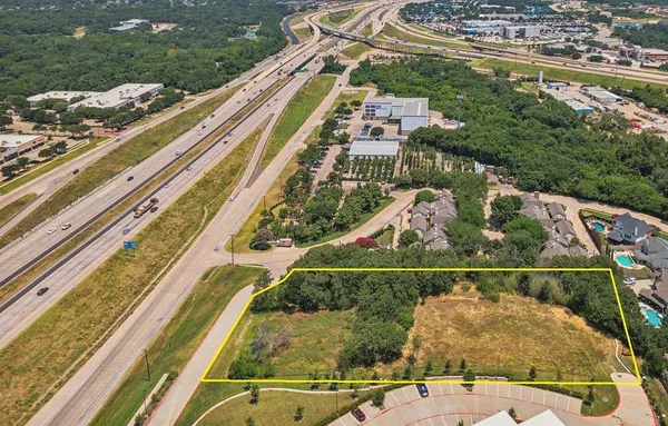 a view of a balcony with floor to ceiling windows