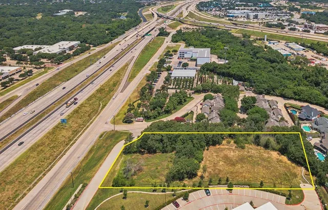 a view of a balcony with floor to ceiling windows