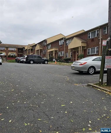 a front view of a house with parking space