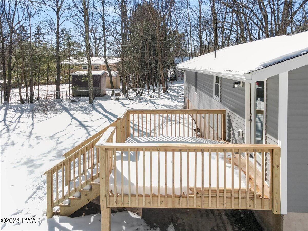 166 Skyview Road Dingmans Ferry, PA 18328 - Photo 19 of 44 a view of a house with a wooden bench
