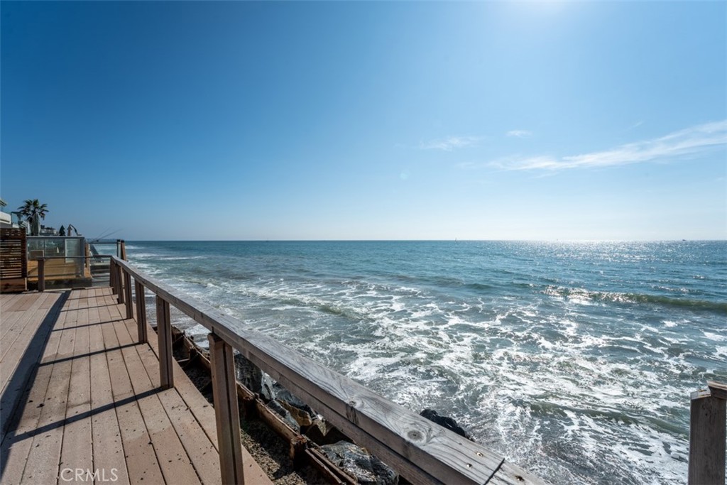 35605 Beach Road Dana Point, CA 92624 - Photo 2 of 55 a view of roof deck with wooden floor and fence