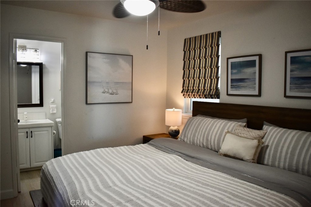 35605 Beach Road Dana Point, CA 92624 - Photo 28 of 55 a bedroom with a bed and a window