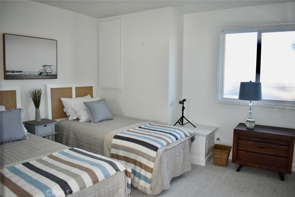 35605 Beach Road Dana Point, CA 92624 - Photo 44 of 55 a bedroom with a bed and a window