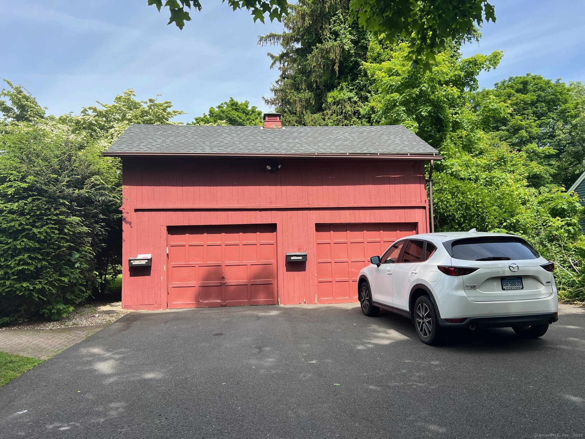 566 West Main Street Cheshire, CT 06410 - Photo 20 of 22 One car garage for this unit.
