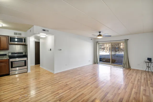 a view of kitchen with sink and stainless steel appliances