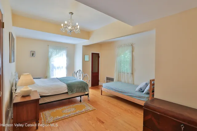 a bedroom with a bed and window