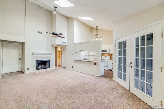a view of a kitchen with furniture and a fireplace