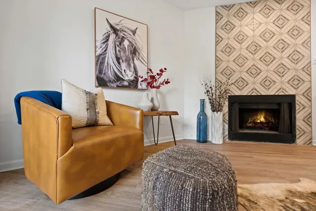 a bedroom with a bed and a fireplace