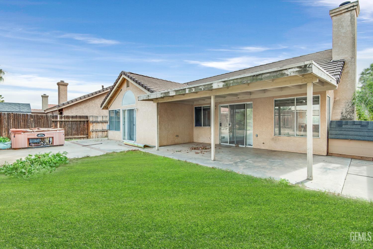 Undisclosed Address Bakersfield, CA 93313 - Photo 25 of 34 a view of a house with a backyard