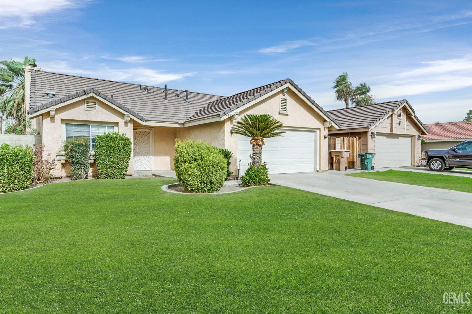 Undisclosed Address Bakersfield, CA 93313 - Photo 32 of 34 a front view of a house with a yard