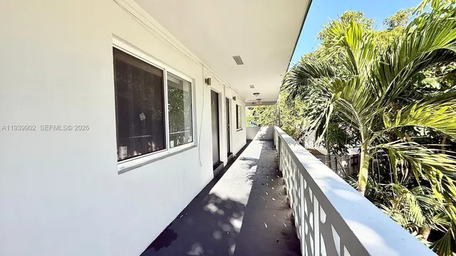 a view of balcony and wooden floor