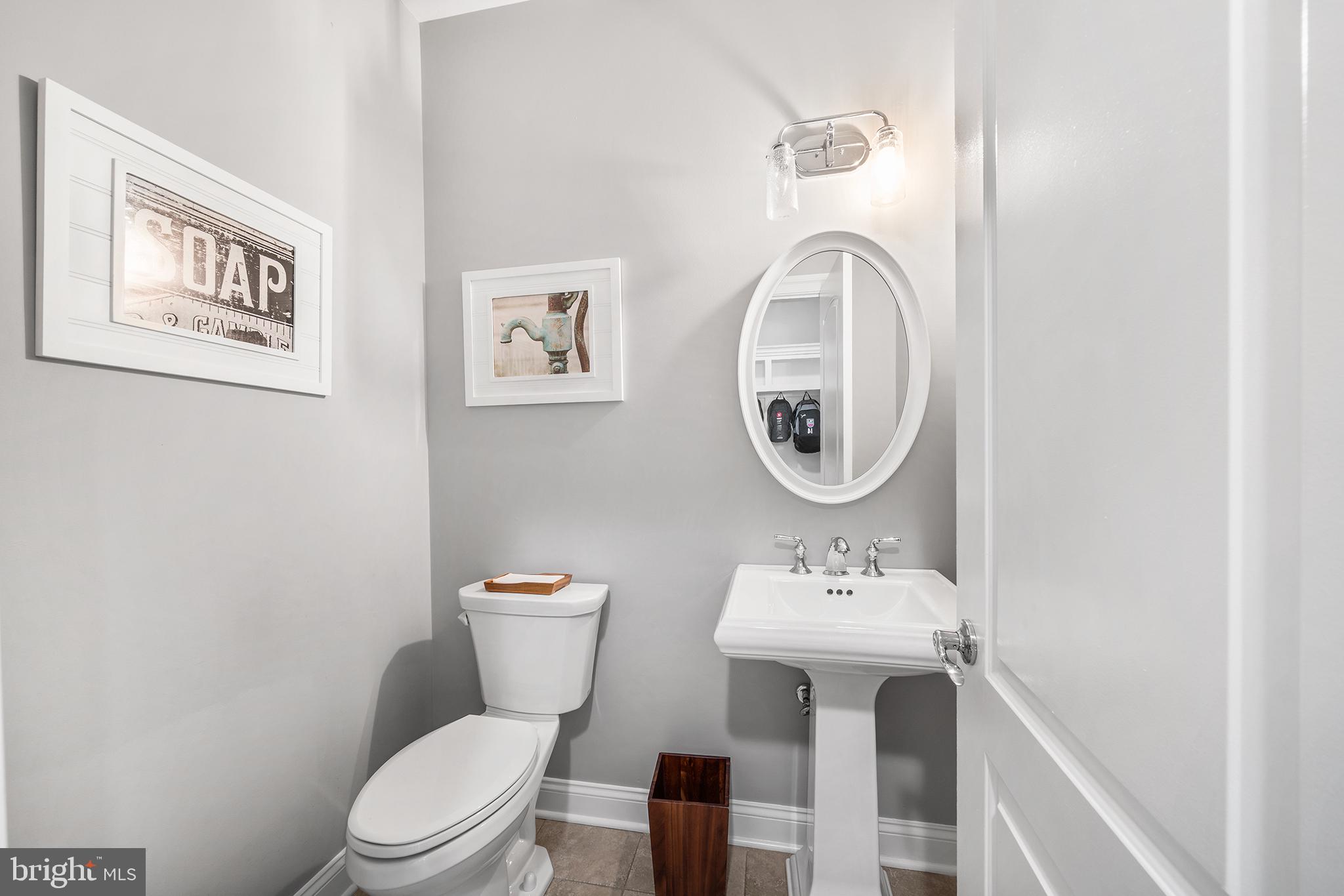 515 Old Eagle School Road Wayne, PA 19087 - Photo 18 of 40 a bathroom with a toilet a sink and a mirror