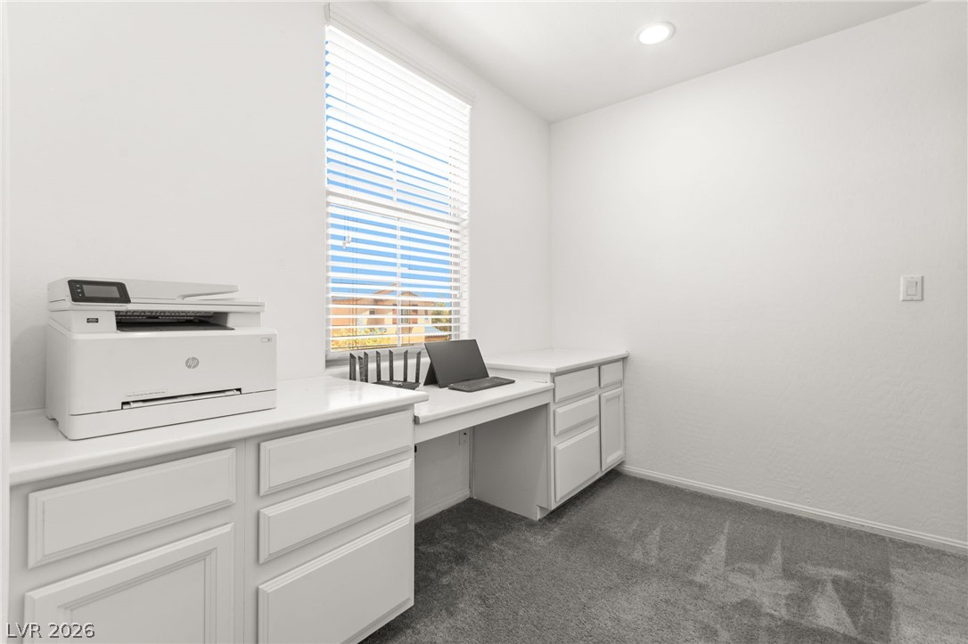 6435 Point Isabel Way Las Vegas, NV 89122 - Photo 22 of 57 Functional office space features built-in desks and ample cabinetry for organization.