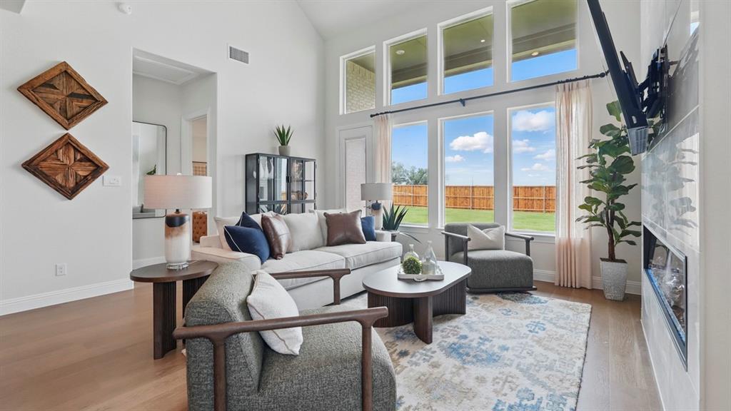 1016 Pitchfork Road Royse City, TX 75189 - Photo 10 of 35 a living room with furniture and a floor to ceiling window