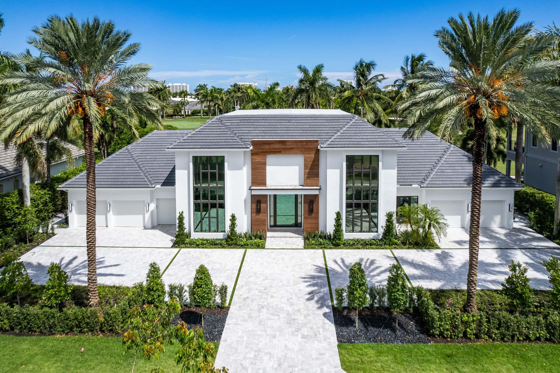 1720 Thatch Palm Drive Boca Raton, FL 33432 - Photo 1 of 1 a front view of a house with a garden
