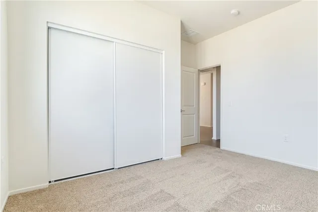 a bathroom with a sink toilet vanity and shower