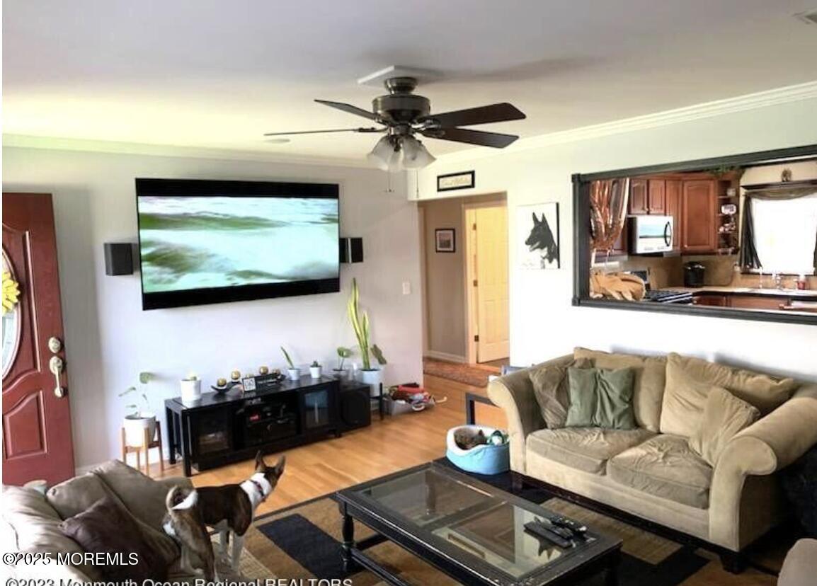 1220 Sunset Avenue Point Pleasant, NJ 08742 - Photo 2 of 10 a living room with furniture and a flat screen tv