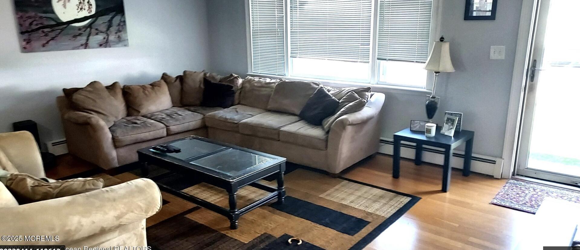 1220 Sunset Avenue Point Pleasant, NJ 08742 - Photo 3 of 10 a living room with furniture and a window