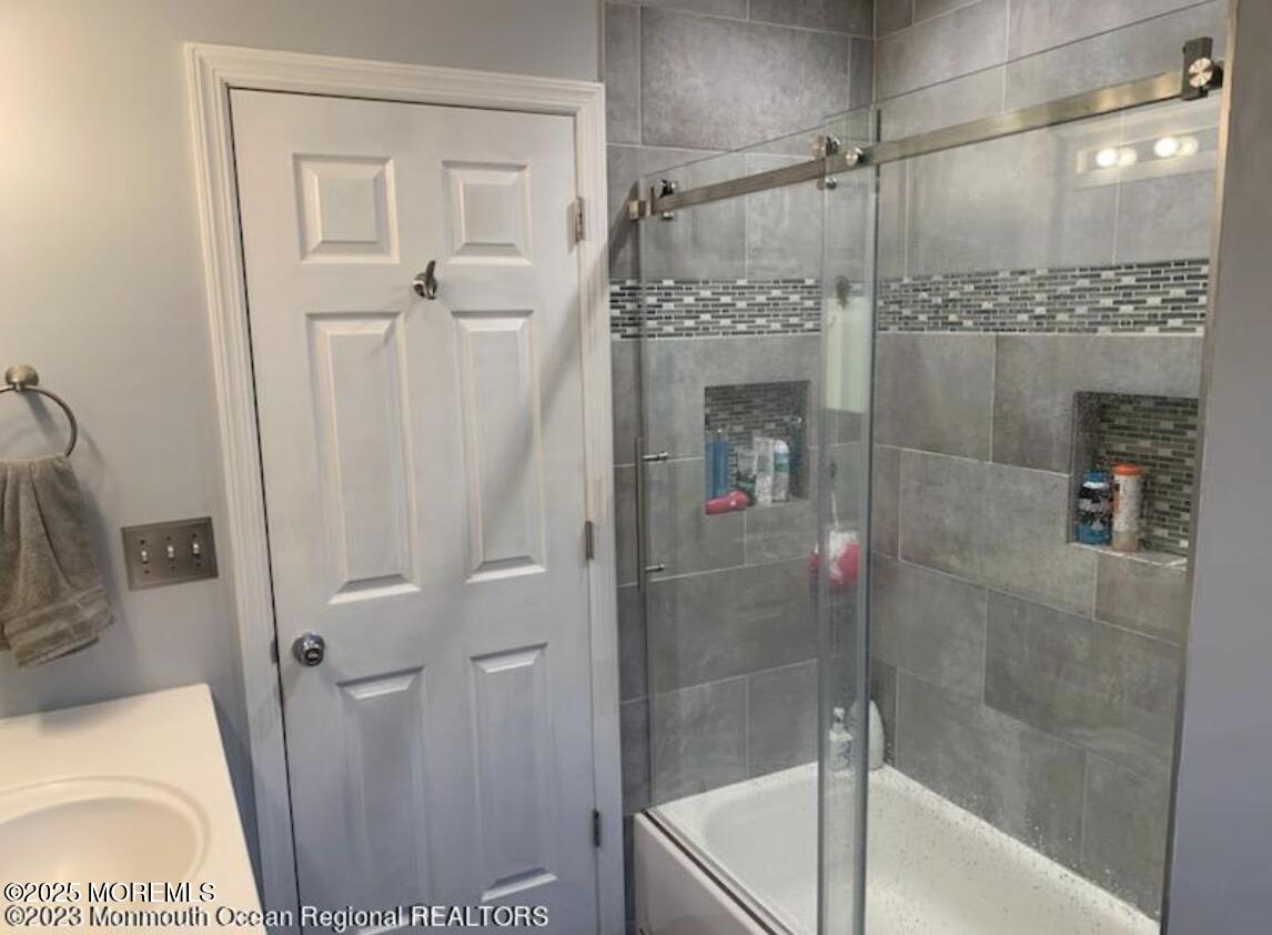 1220 Sunset Avenue Point Pleasant, NJ 08742 - Photo 7 of 10 a bathroom with a shower