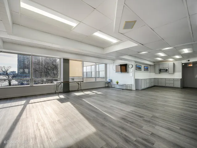 a utility room with stainless steel appliances and cabinets