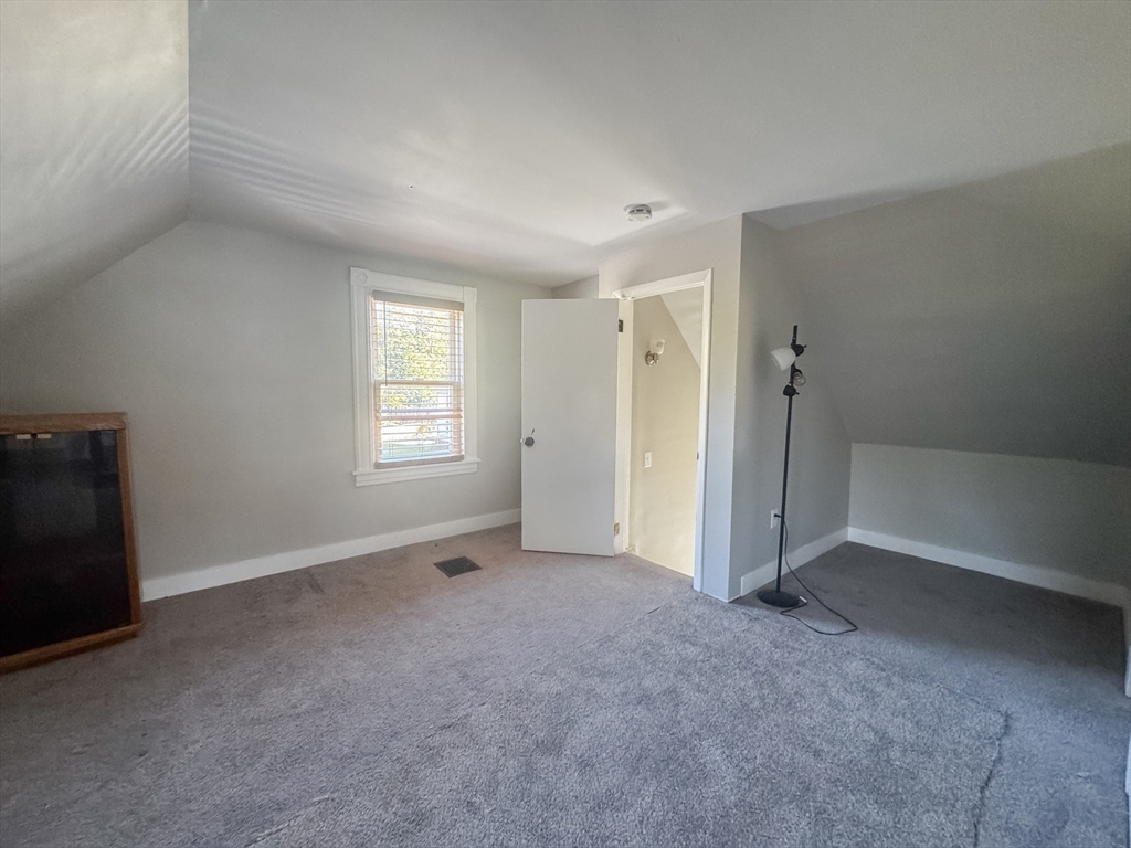 3-5 Noel Street Springfield, MA 01108 - Photo 26 of 28 a view of an empty room with a window
