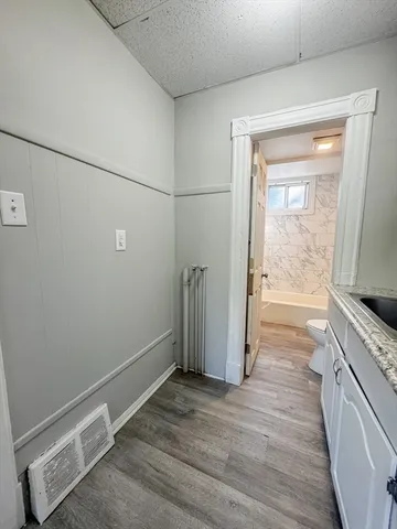 a view of cabinets and wooden floor