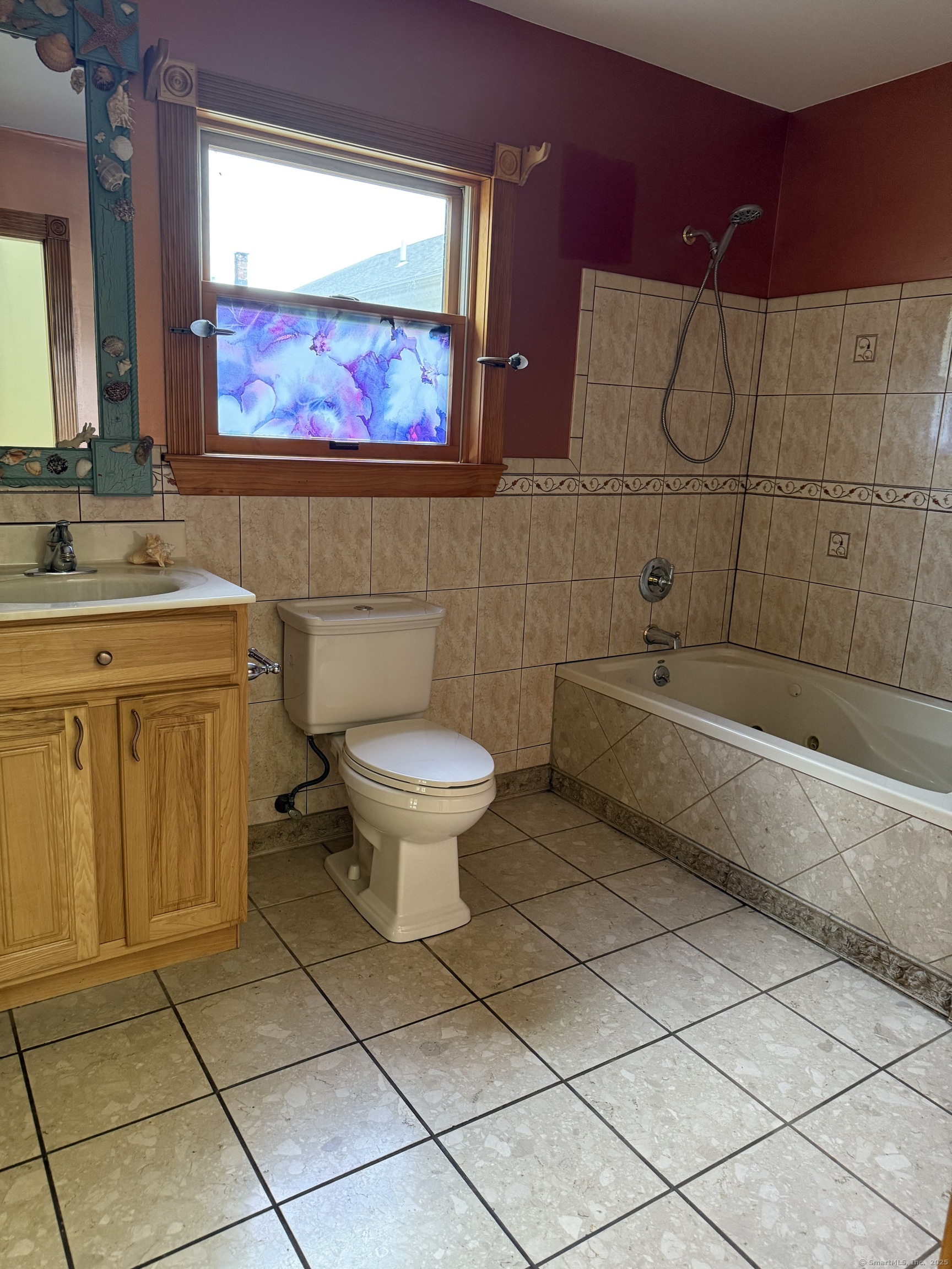28 Galpin Street Naugatuck, CT 06770 - Photo 11 of 16 a bathroom with a sink a toilet and mirror