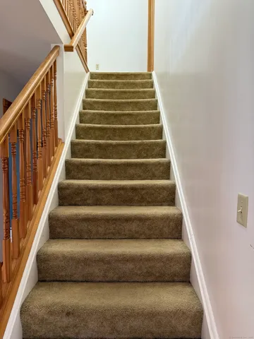 a view of staircase with empty racks