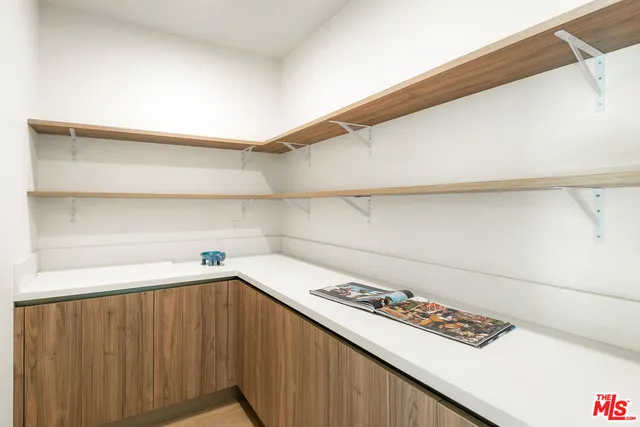 a kitchen with a cabinets and a stove top oven