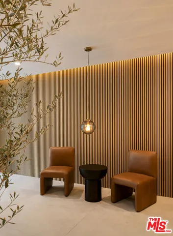 a view of a couch in wooden floor