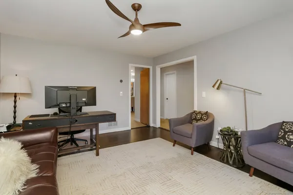 a living room with furniture and a window