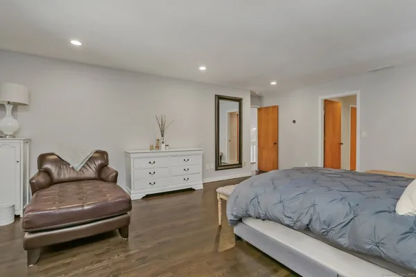 a bedroom with a bed and a couch