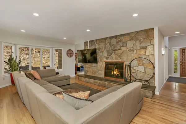 a living room with furniture and a fireplace
