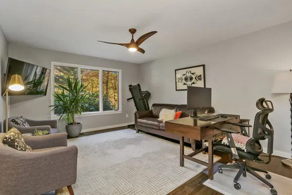 a living room with furniture and a window