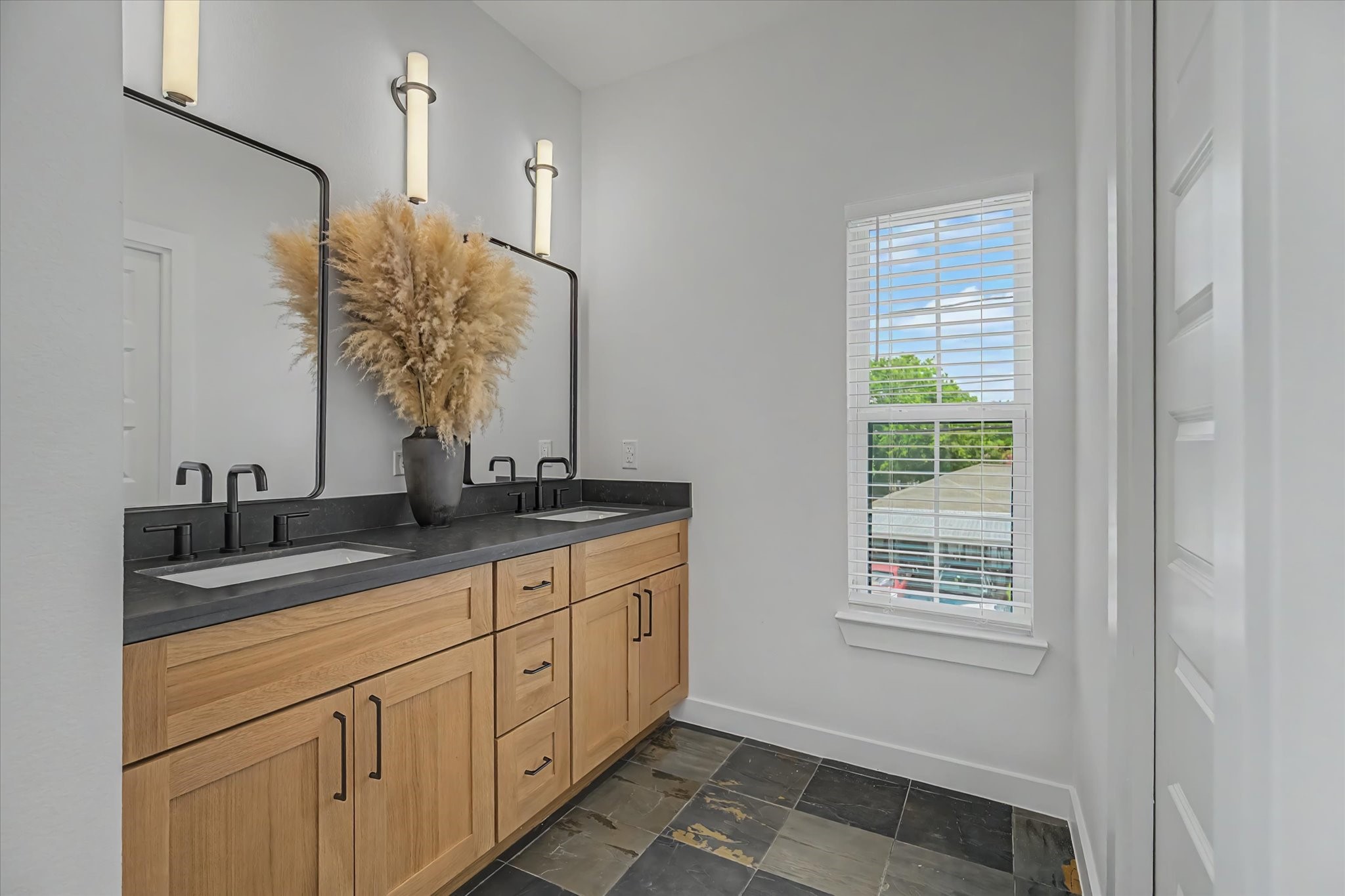 3806 Dreyfus Street Houston, TX 77021 - Photo 26 of 48 This bathroom features a double vanity with soft-close cabinets and drawers for ample storage.